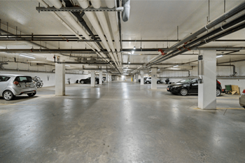 a parking garage with cars parked in it